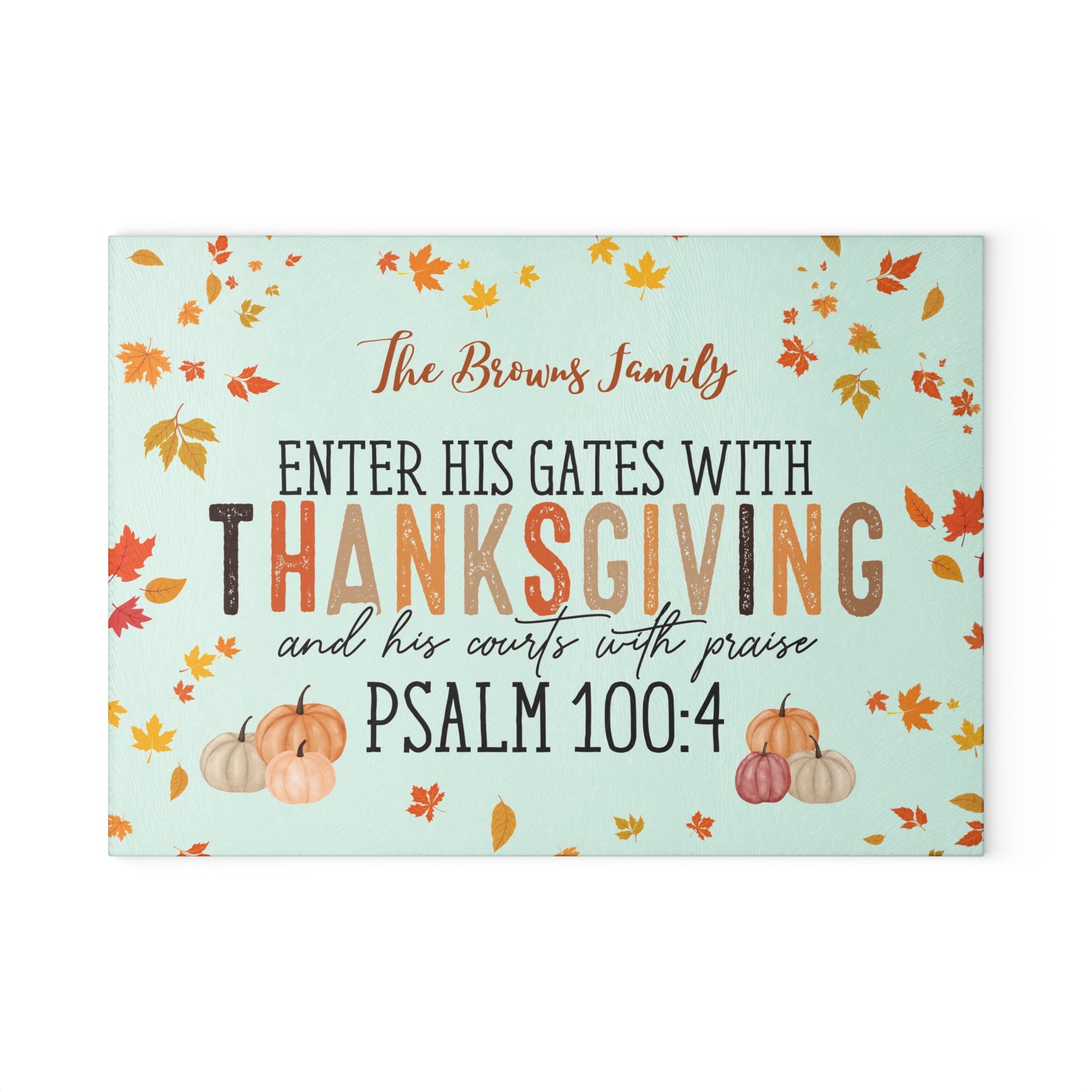 Thanksgiving-themed decorative sign with pumpkins and leaves on a light blue background