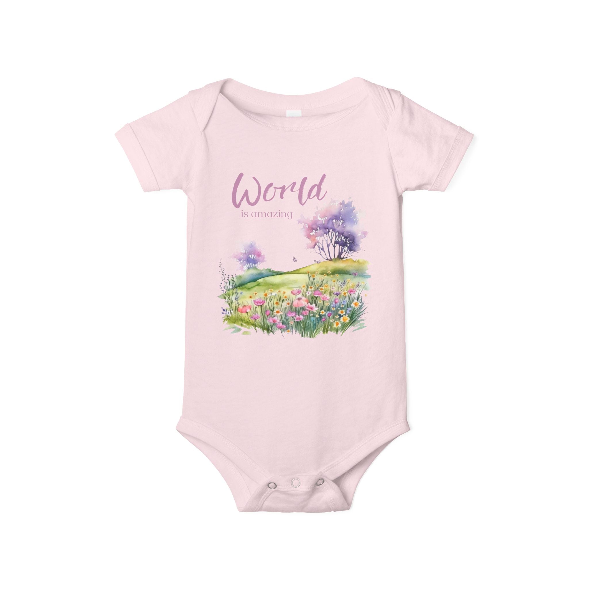 Baby onesie with "World is amazing" text and pastel nature design, made from soft 100% Airlume cotton, displayed flat with envelope neckline and snap closures.