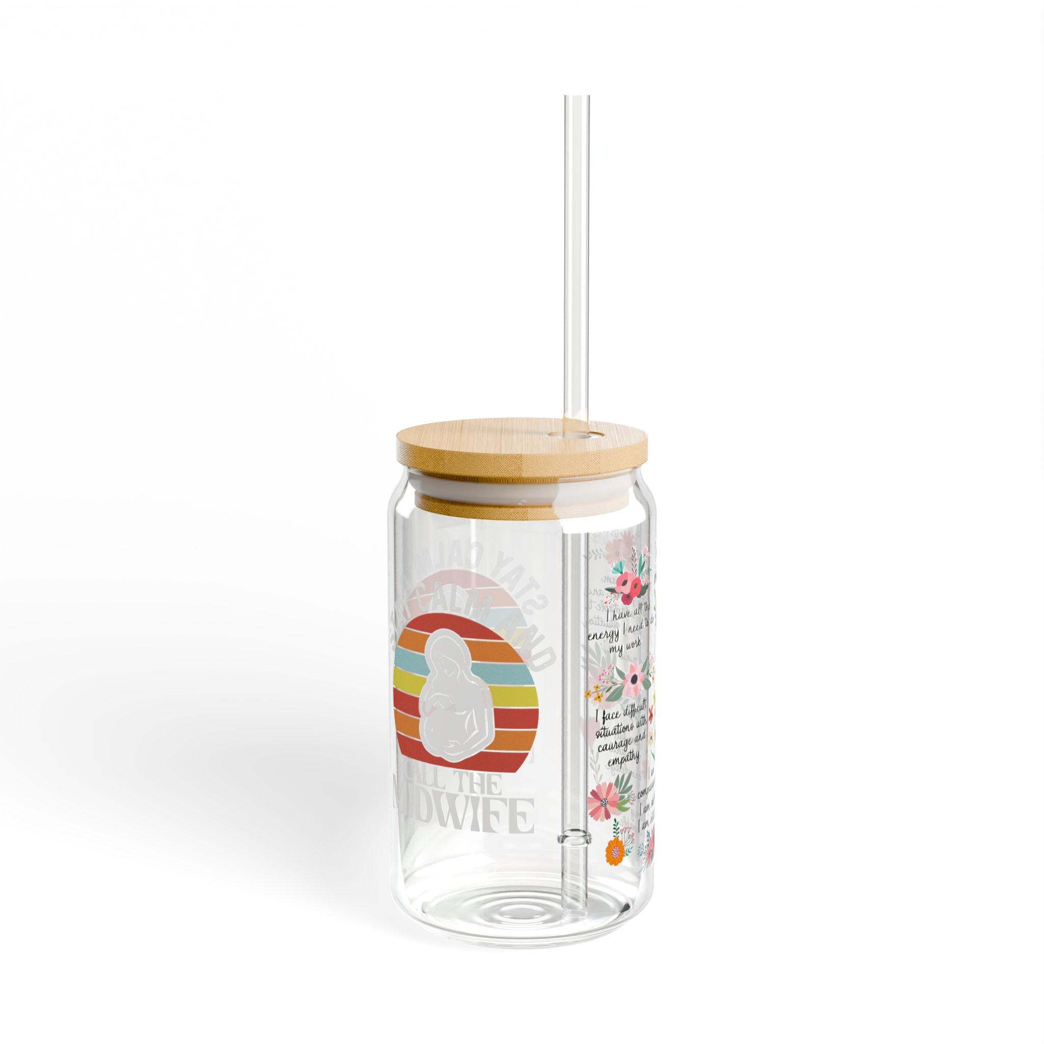 Clear tumbler with wooden lid and straw on a white background