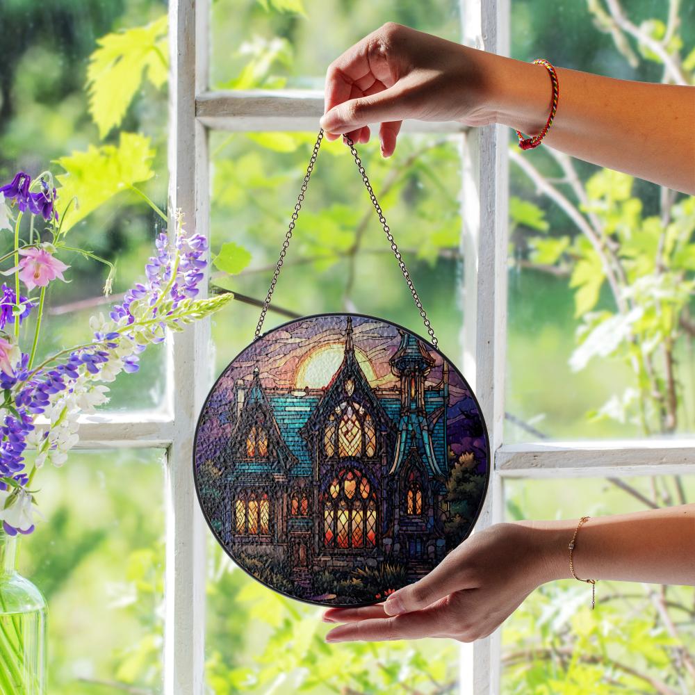Stained glass suncatcher featuring a gothic mansion with a full moon