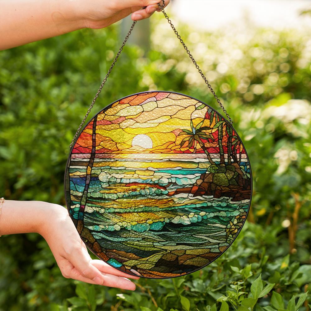 Stained glass suncatcher featuring a vibrant beach sunset with ocean waves and warm colors
