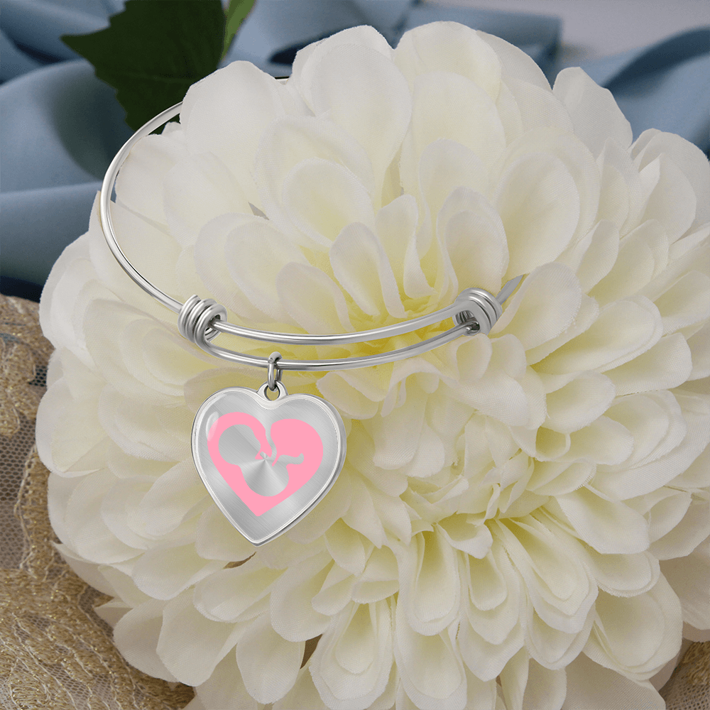 Pro-Life silver Heart Bracelet, featuring a graceful fetal silhouette embraced in a soft pink heart