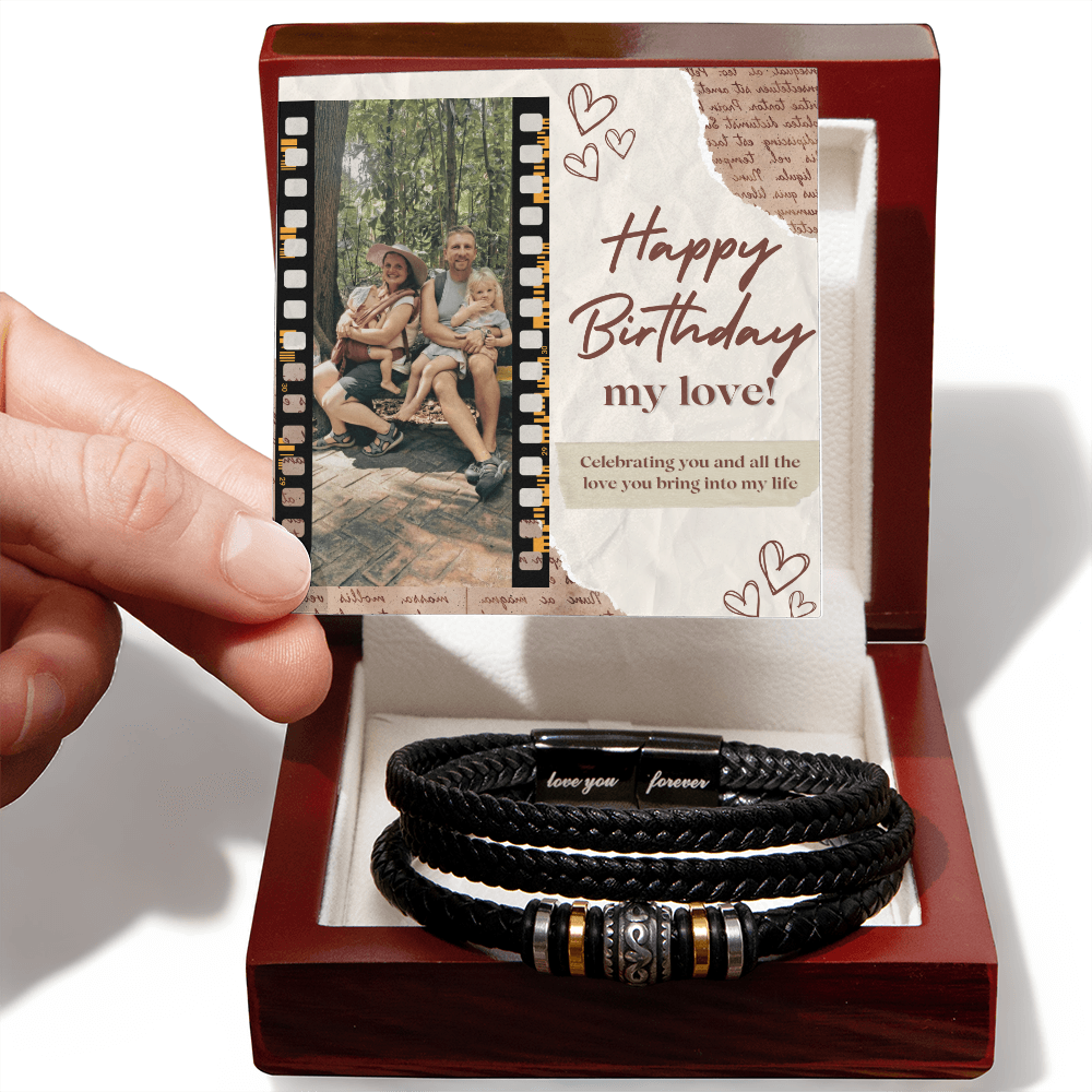 A personalized black bracelet with a decorative bead and a custom note, presented in a wooden box with a photo and a birthday message.