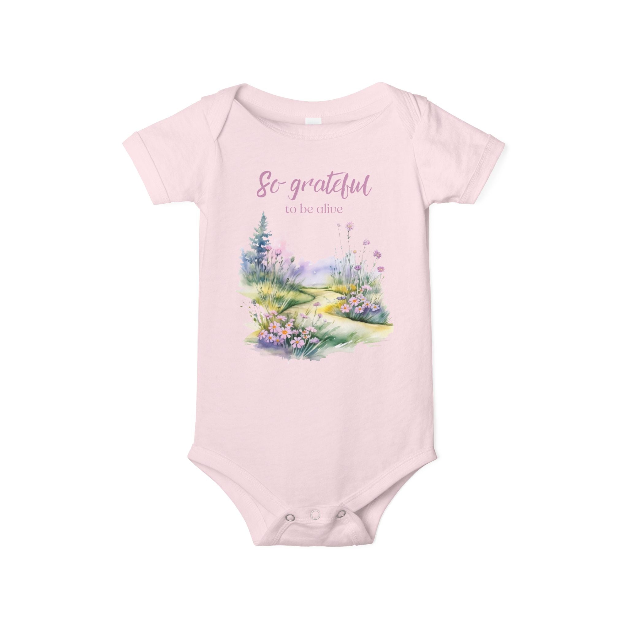 Baby onesie with "So grateful to be alive!" text and pastel nature design, made from soft 100% Airlume cotton, shown flat with envelope neckline and snap closures.