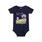 Baby onesie with "World is amazing" text and pastel nature design, made from soft 100% Airlume cotton, displayed flat with envelope neckline and snap closures.