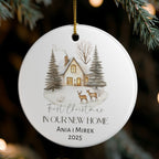 Personalized Christmas ornament with a house and trees design, hanging on a tree.