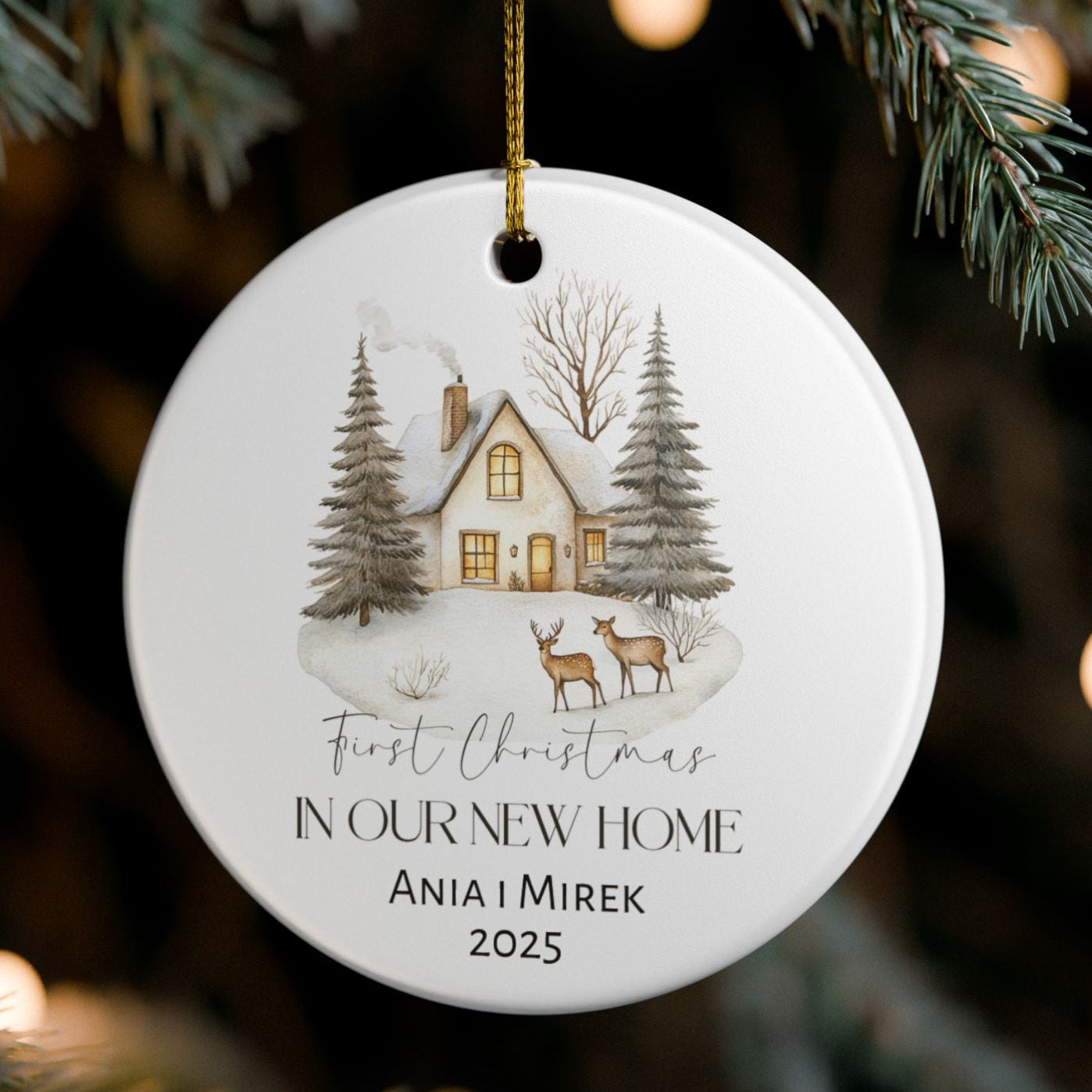 Personalized Christmas ornament with a house and trees design, hanging on a tree.