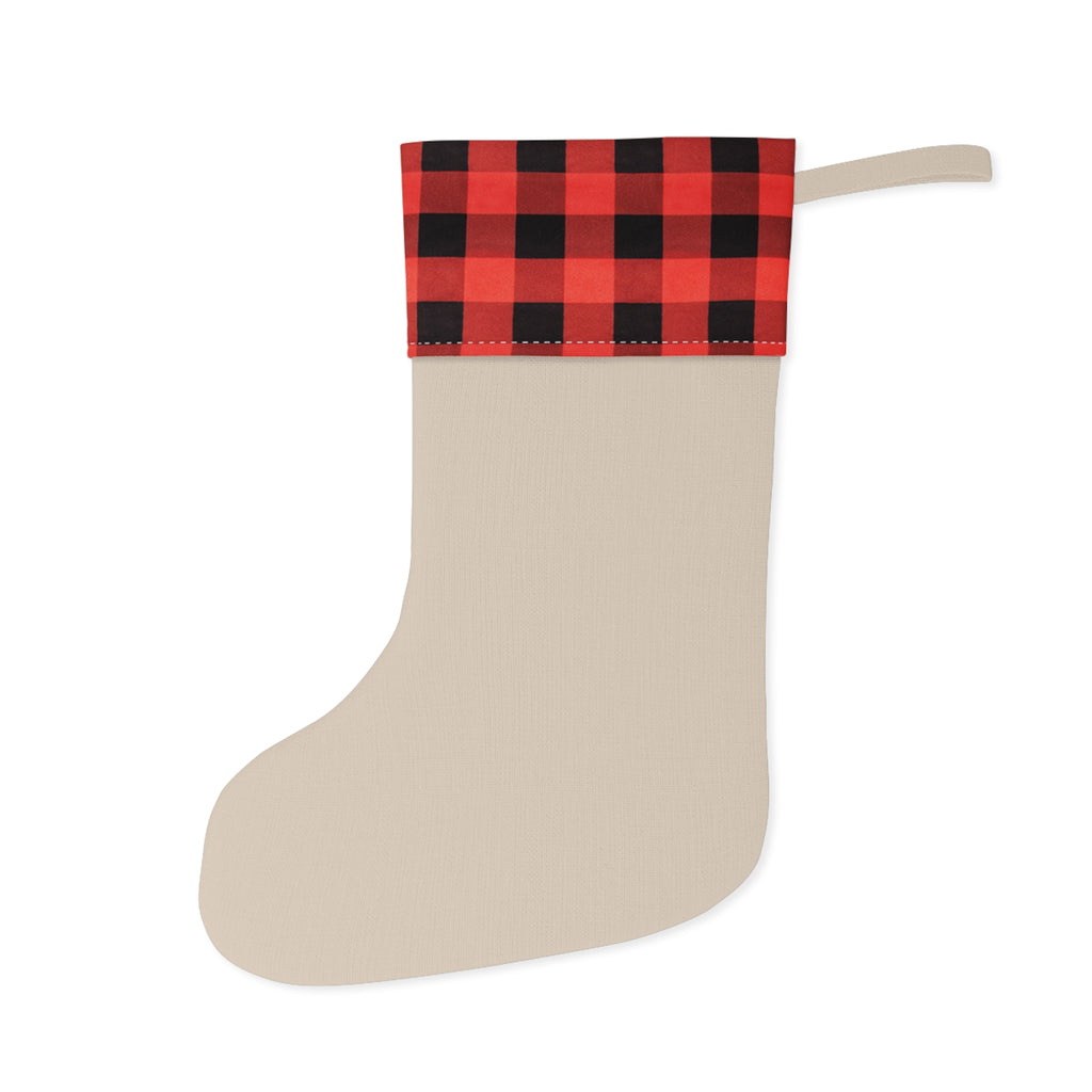 Beige Christmas stocking with red and black plaid top on a white background