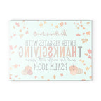 Thanksgiving-themed card with pumpkins and leaves on a light blue background