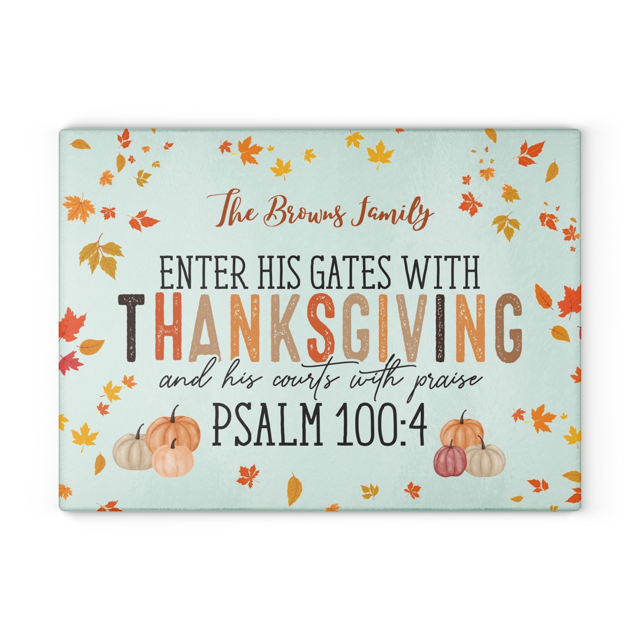 Decorative sign with Thanksgiving message and pumpkins on a light blue background