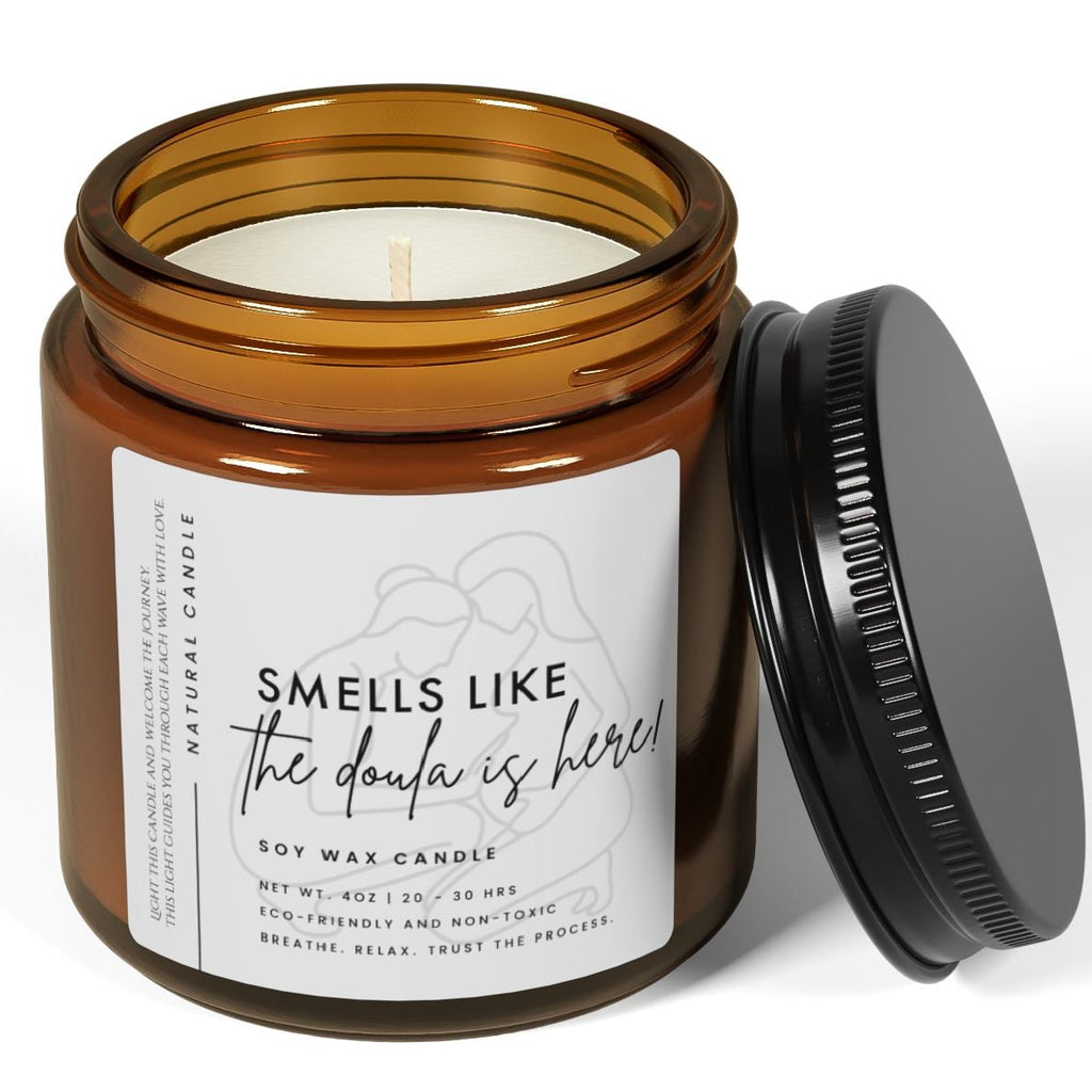 labor Candle in an amber jar with a black lid on a white background - smells like the doula is here