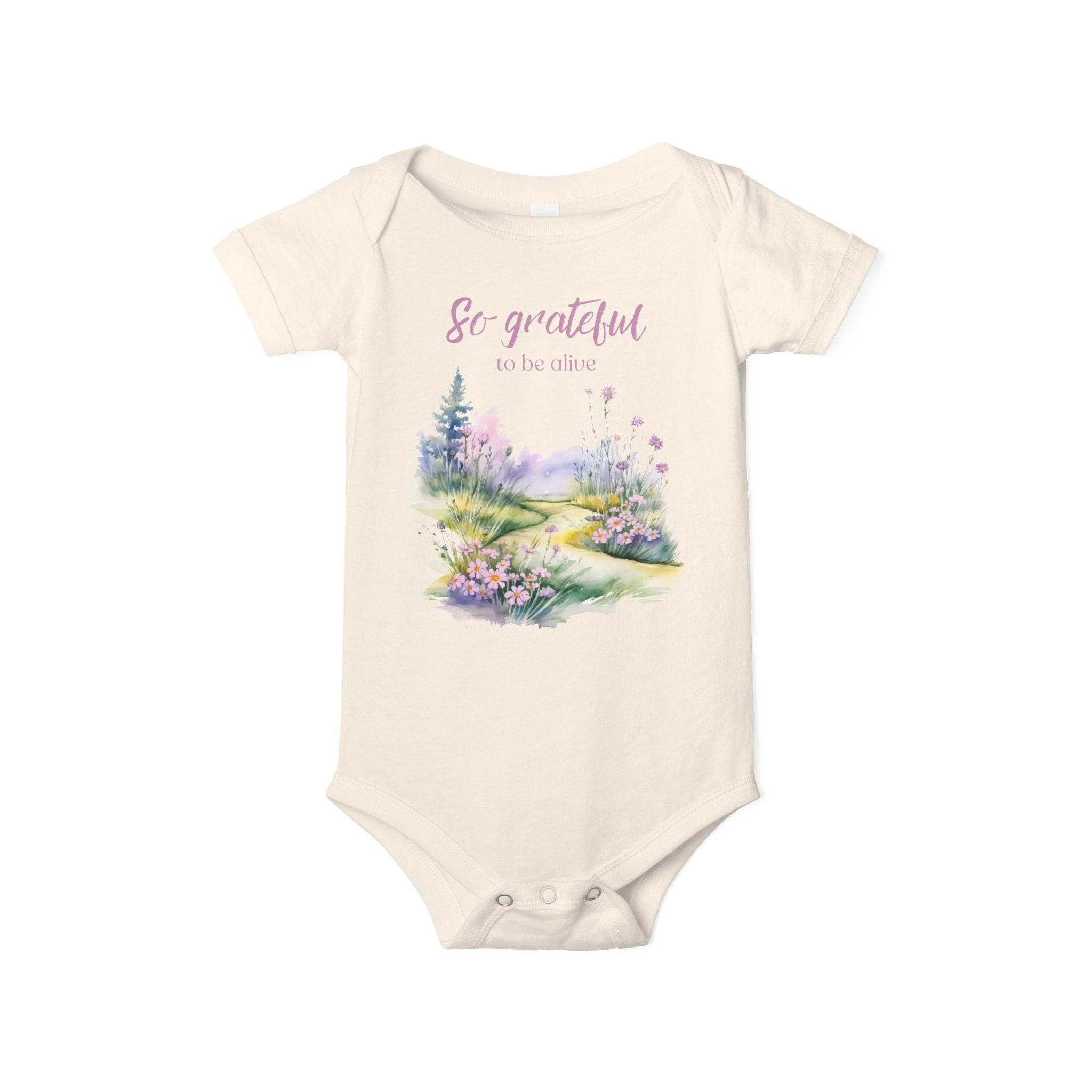 Baby onesie with "So grateful to be alive!" text and pastel nature design, made from soft 100% Airlume cotton, shown flat with envelope neckline and snap closures.