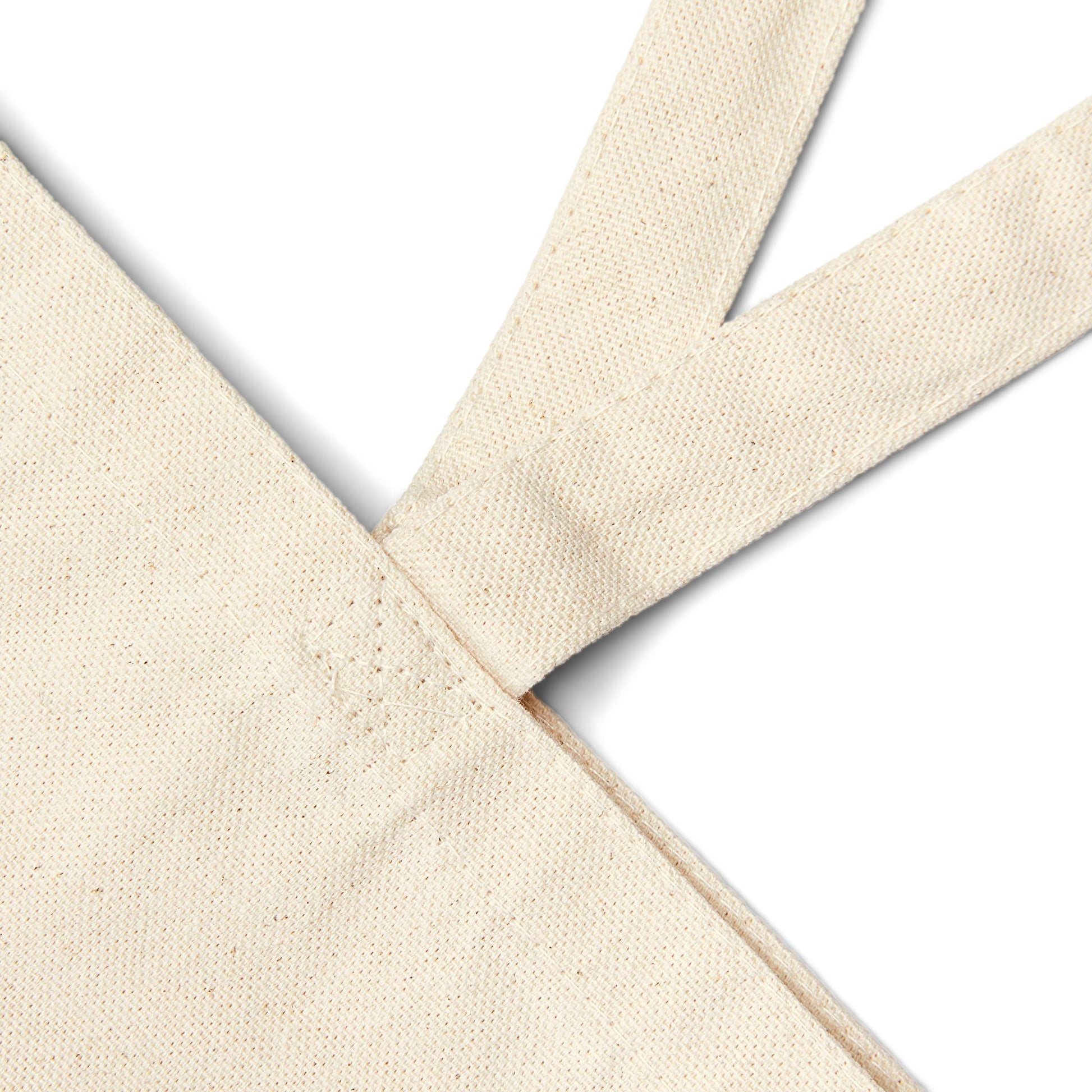 Natural cotton Christian tote bag with 'Walking by Faith and Carrying Diapers' text, designed for moms, featuring sturdy canvas handles and faith-inspired message.