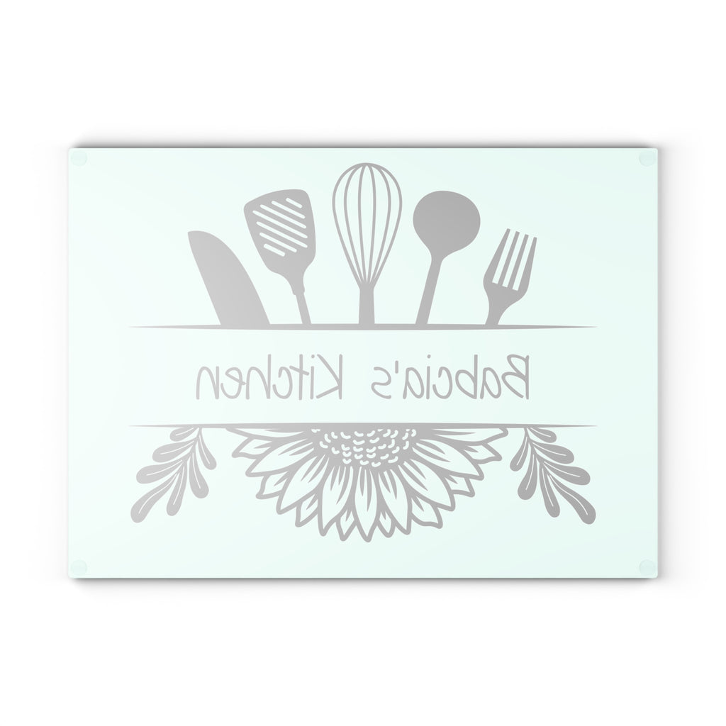 Decorative glass cutting board with utensil design and 'Babcia's Kitchen' text. For Polish babcia in the USA.