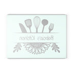 Decorative glass cutting board with utensil design and 'Babcia's Kitchen' text. For Polish babcia in the USA.