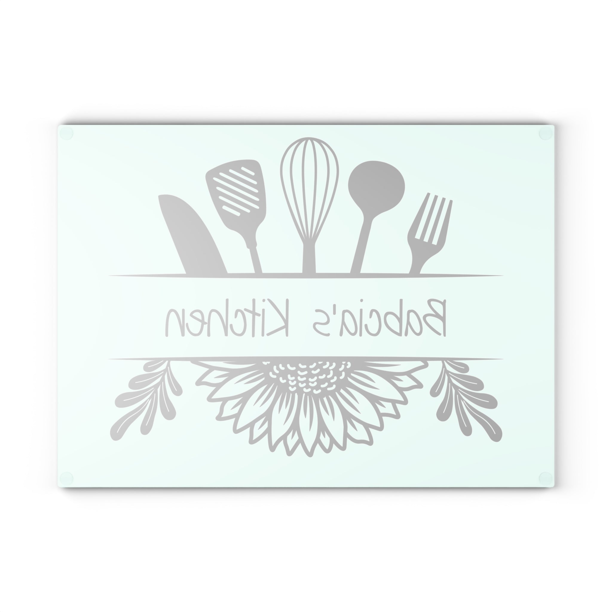 Decorative glass cutting board with utensil design and 'Babcia's Kitchen' text. For Polish babcia in the USA.