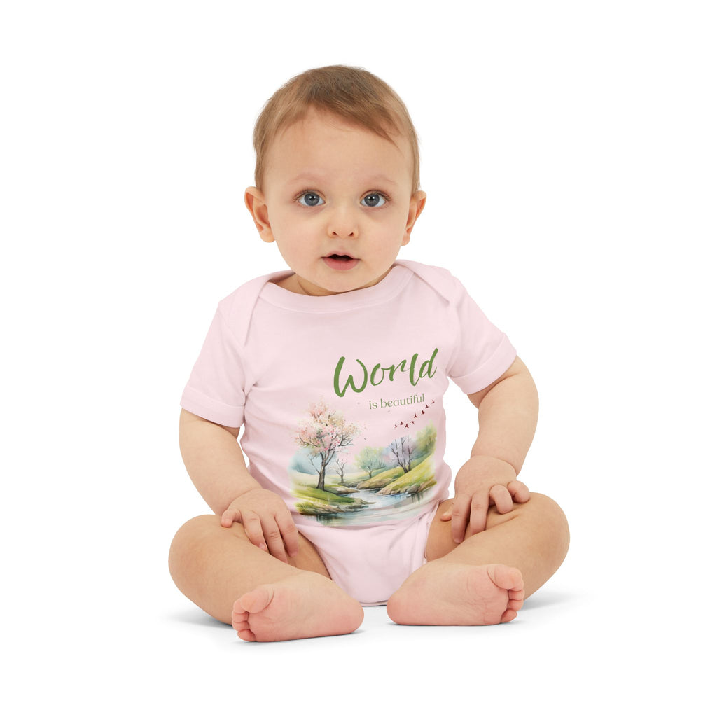 Baby onesie with "World is beautiful" text and pastel nature design, made from soft 100% Airlume cotton, displayed flat with envelope neckline and snap closures.