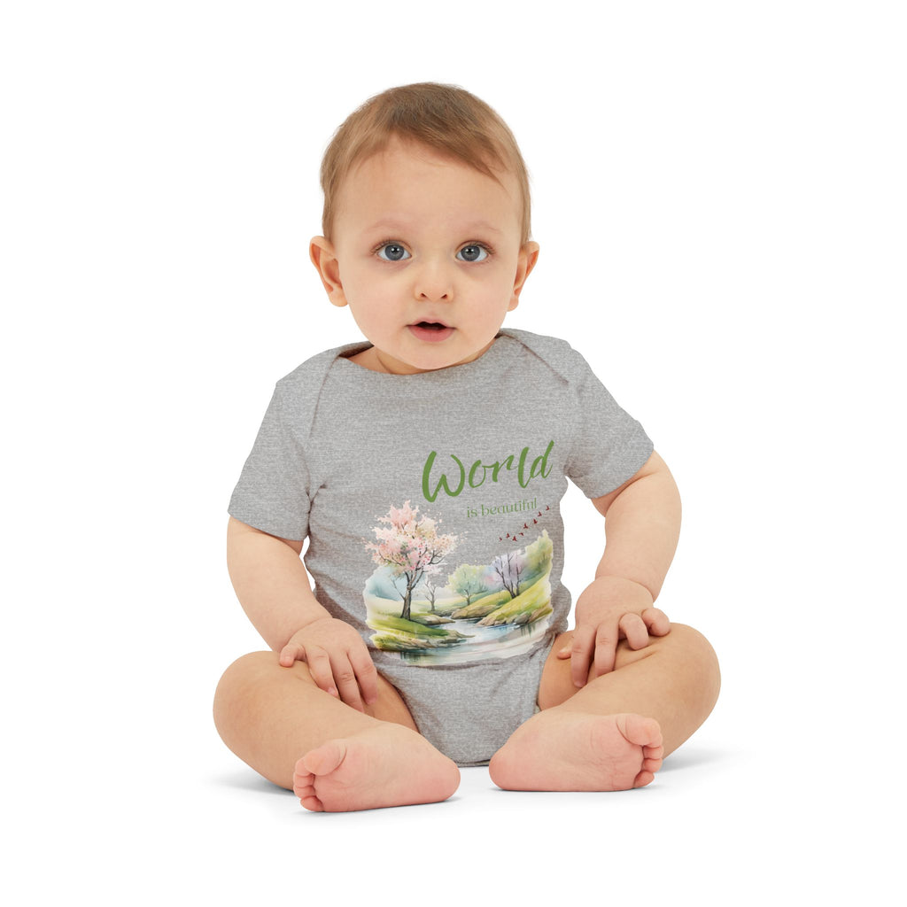 Baby onesie with "World is beautiful" text and pastel nature design, made from soft 100% Airlume cotton, displayed flat with envelope neckline and snap closures.