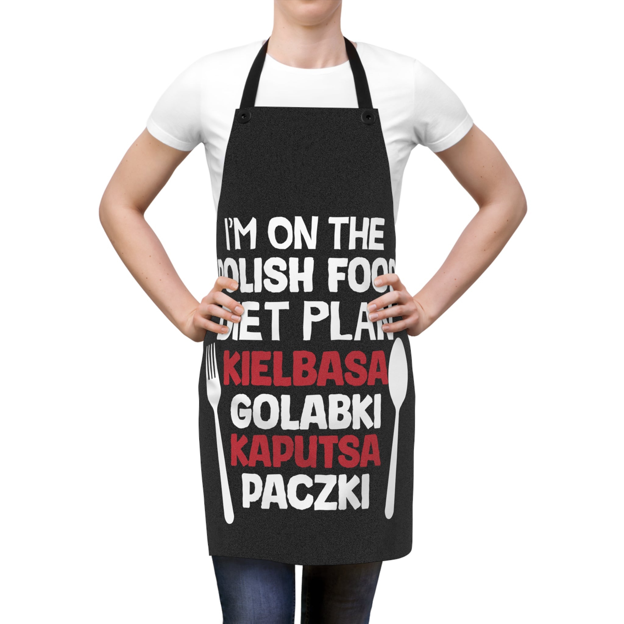 Person wearing a black apron with Polish food-themed text for polonia in the USA