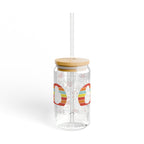 Clear tumbler with wooden lid and straw on a white background