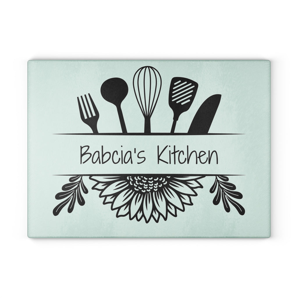 Decorative glass cutting board with utensil design and 'Babcia's Kitchen' text. For Polish babcia in the USA.