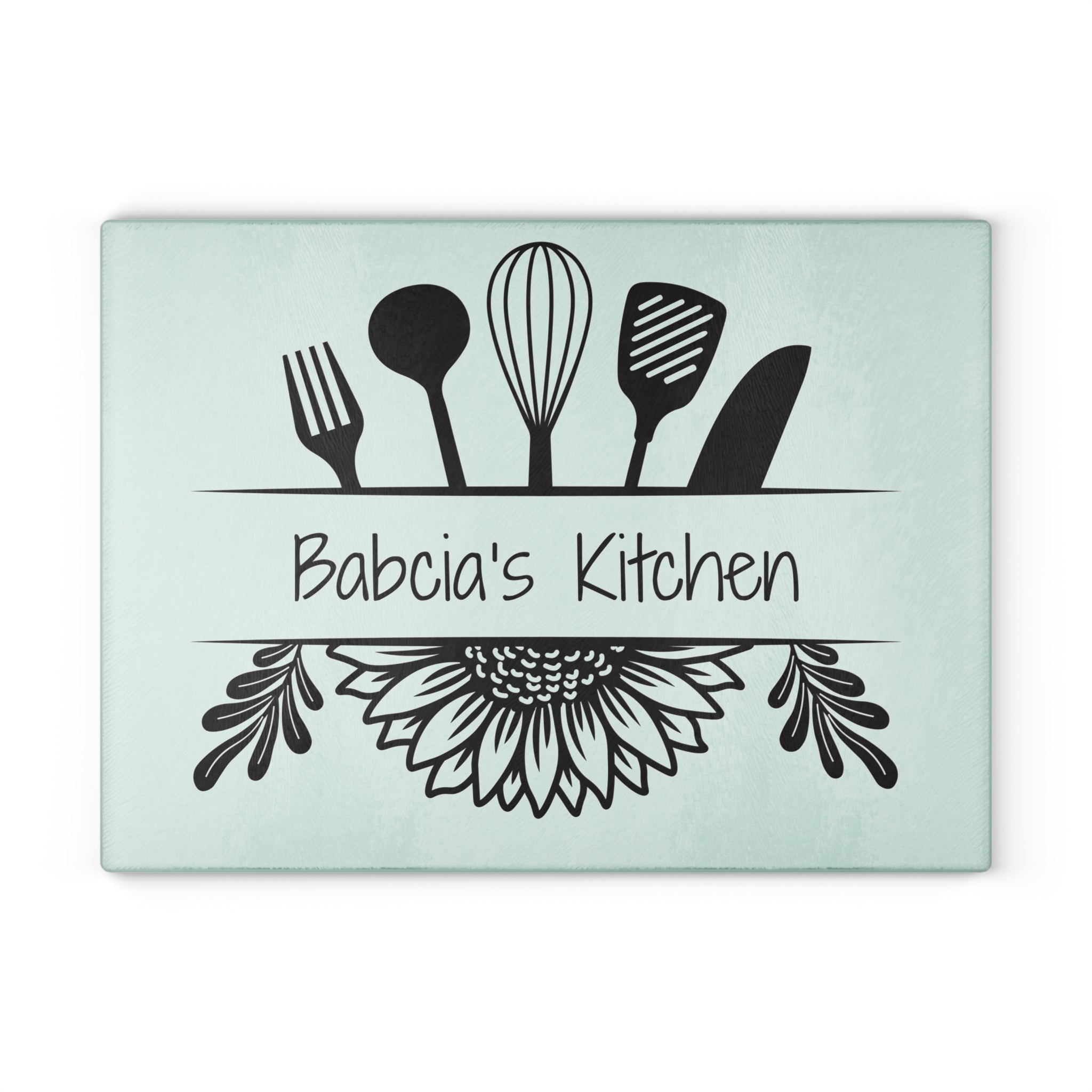 Decorative glass cutting board with utensil design and 'Babcia's Kitchen' text. For Polish babcia in the USA.