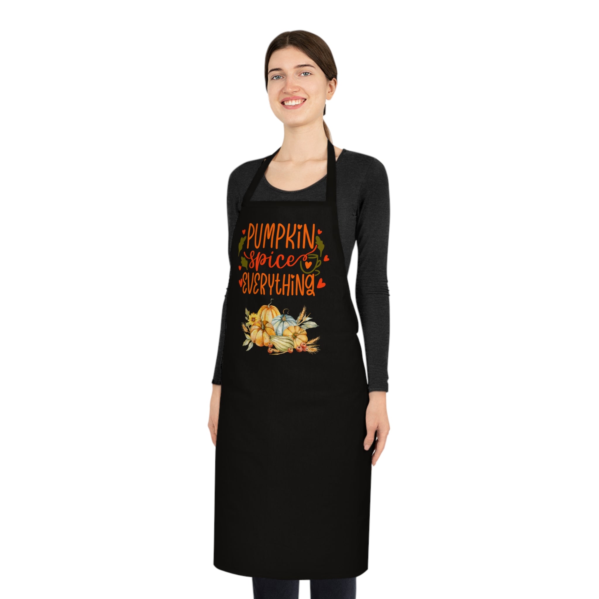 Person wearing a black apron with 'Pumpkin Spice Everything' text and graphics on a white background