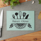 Decorative glass cutting board with utensil design and 'Babcia's Kitchen' text. For Polish babcia in the USA.