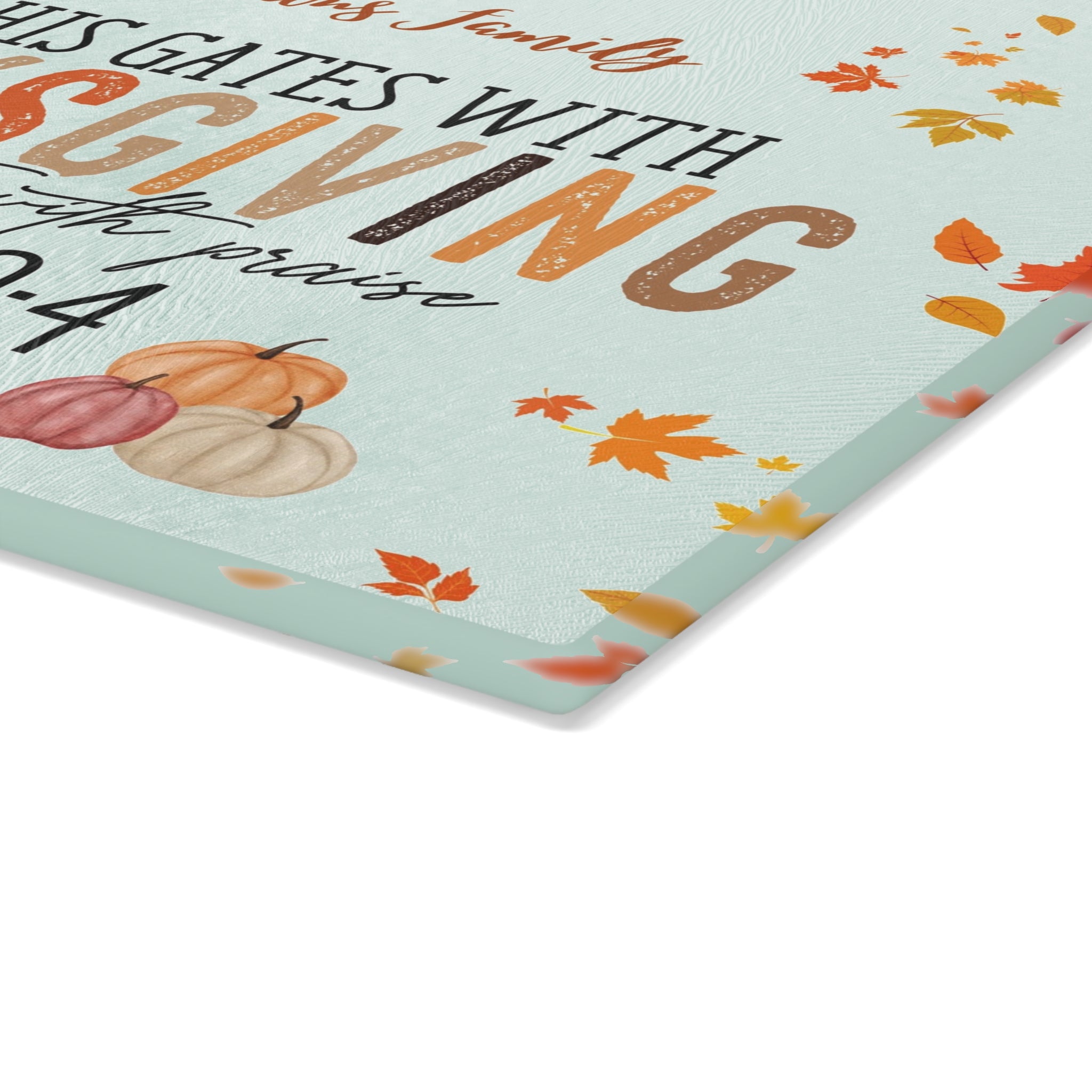 Thanksgiving-themed placemat with pumpkins and leaves on a light blue background