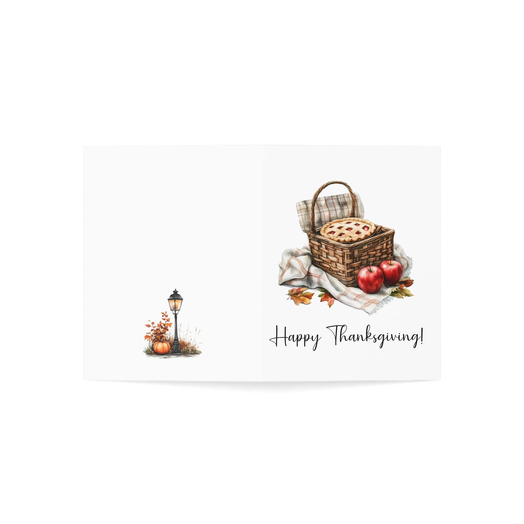Thanksgiving-themed card with a basket of food, apples, and a lantern on a white background.