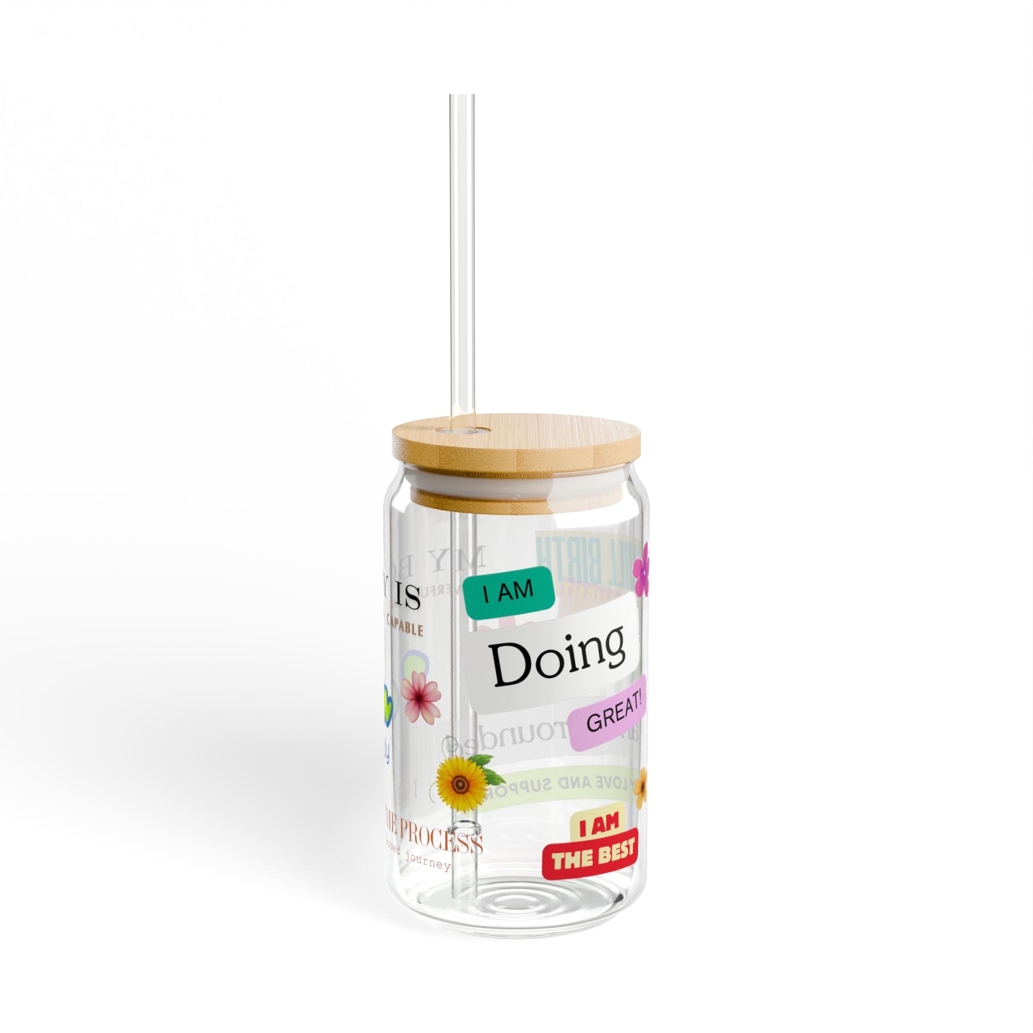 Clear tumbler with motivational phrases for birth and pregnancy and a wooden lid on a white background