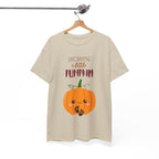 Beige t-shirt with a pumpkin graphic and text on a hanger against a white background