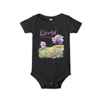 Baby onesie with "World is amazing" text and pastel nature design, made from soft 100% Airlume cotton, displayed flat with envelope neckline and snap closures.
