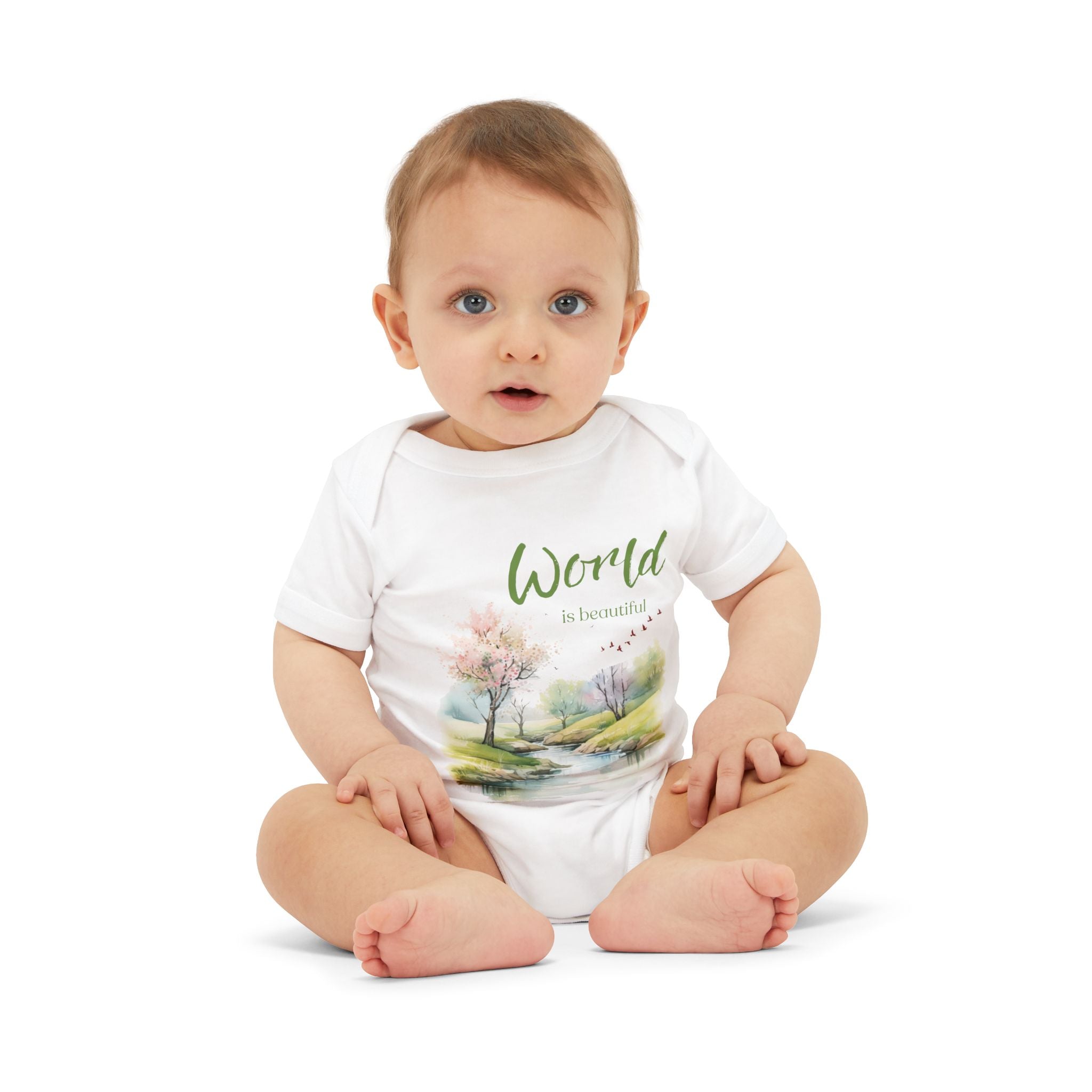 Baby onesie with "World is beautiful" text and pastel nature design, made from soft 100% Airlume cotton, displayed flat with envelope neckline and snap closures.