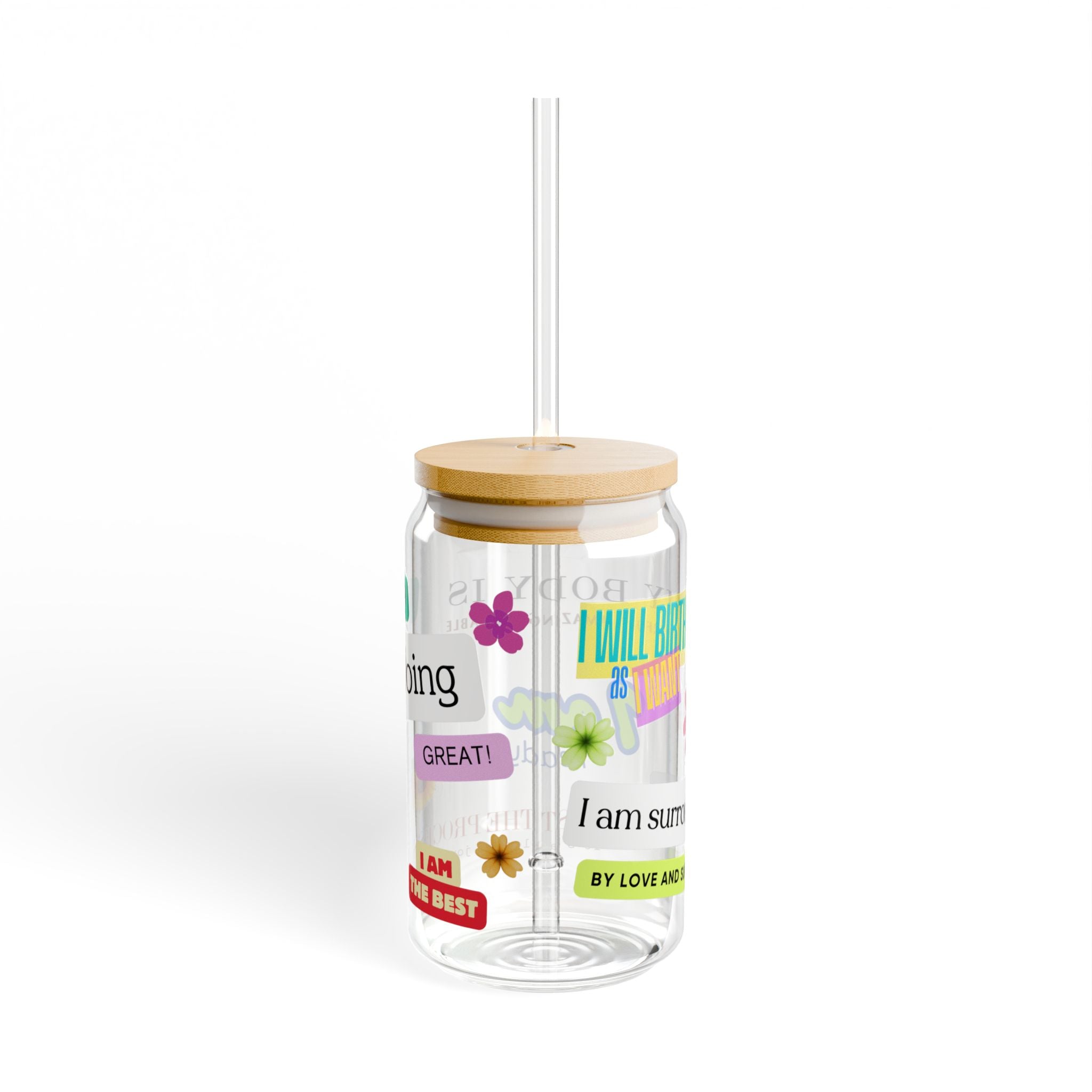 Clear tumbler with motivational phrases for birth and pregnancy and a wooden lid on a white background