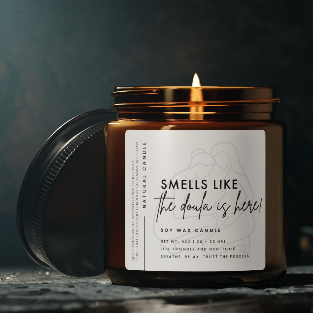 Birth Labor Candle with a label - smells like the doula is here - on a dark background