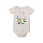 Baby onesie with "So grateful to be alive!" text and pastel nature design, made from soft 100% Airlume cotton, shown flat with envelope neckline and snap closures.