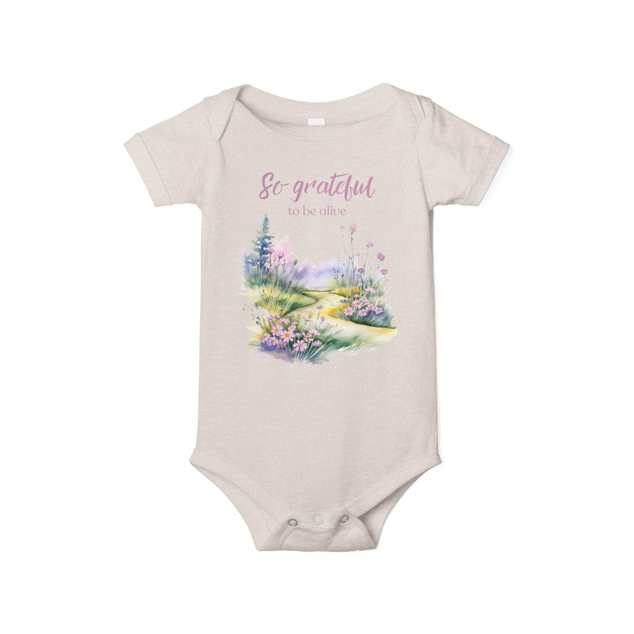 Baby onesie with "So grateful to be alive!" text and pastel nature design, made from soft 100% Airlume cotton, shown flat with envelope neckline and snap closures.