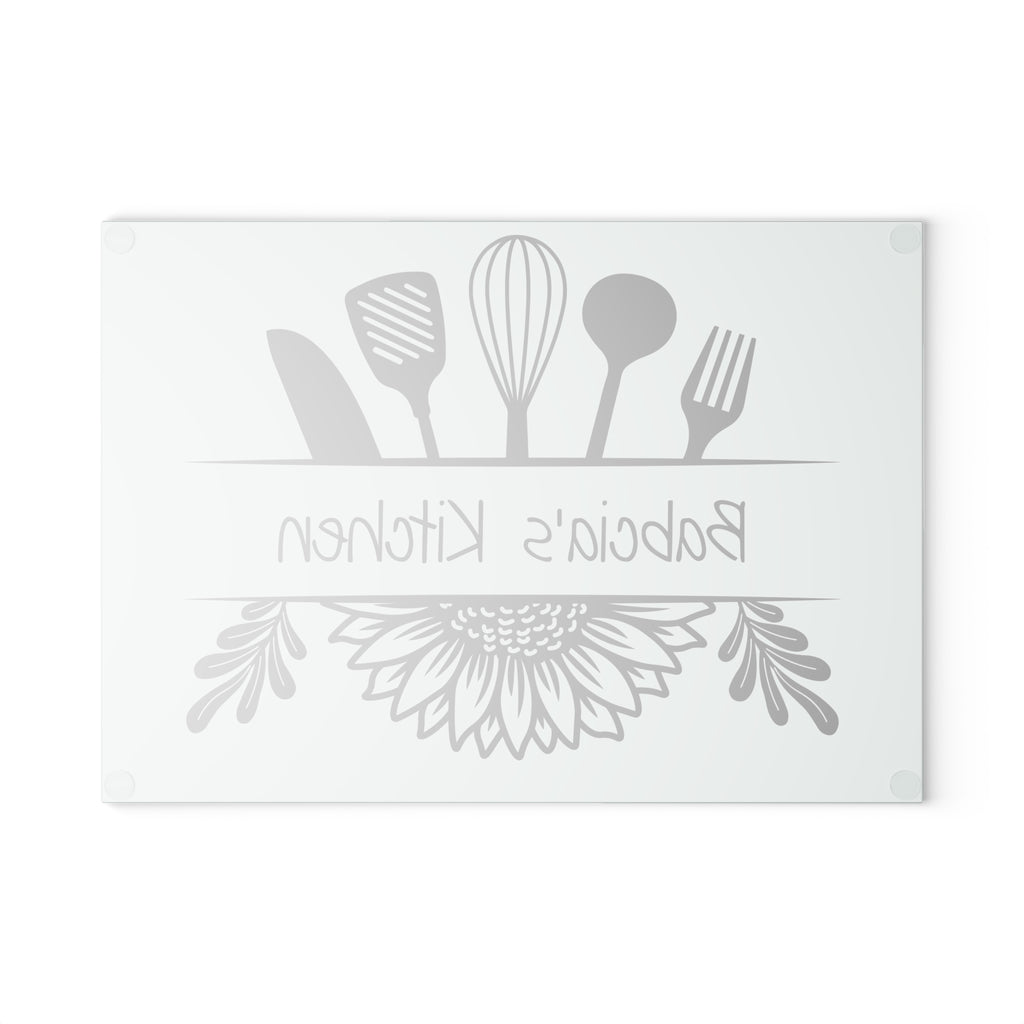 Decorative glass cutting board with utensil design and 'Babcia's Kitchen' text. For Polish babcia in the USA.