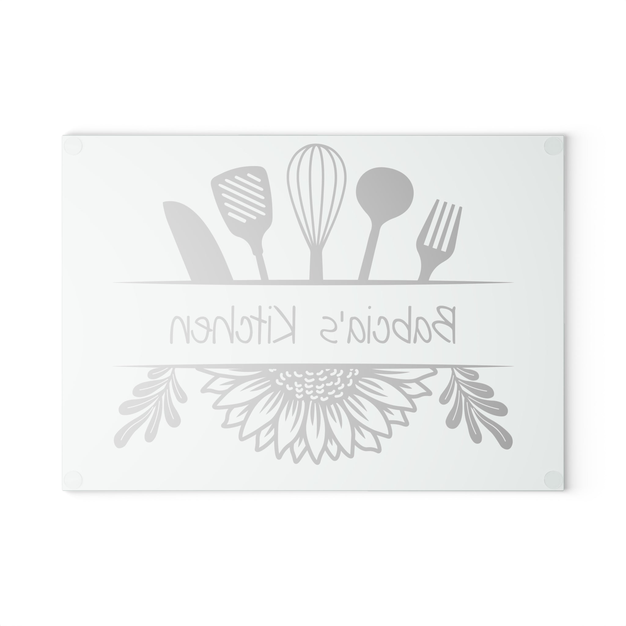 Decorative glass cutting board with utensil design and 'Babcia's Kitchen' text. For Polish babcia in the USA.