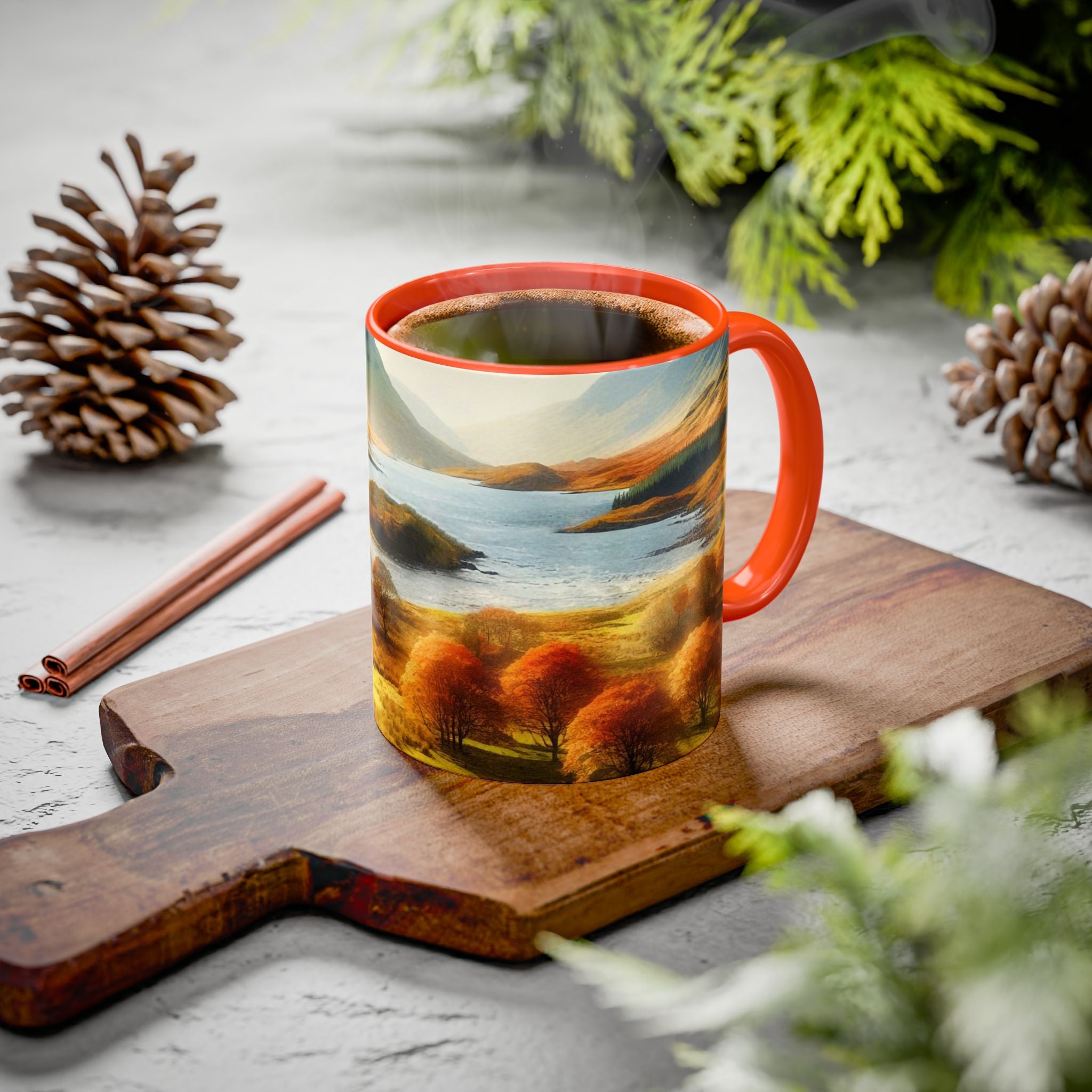 Mug with scenic design on a wooden board with pine cones and cinnamon sticks.