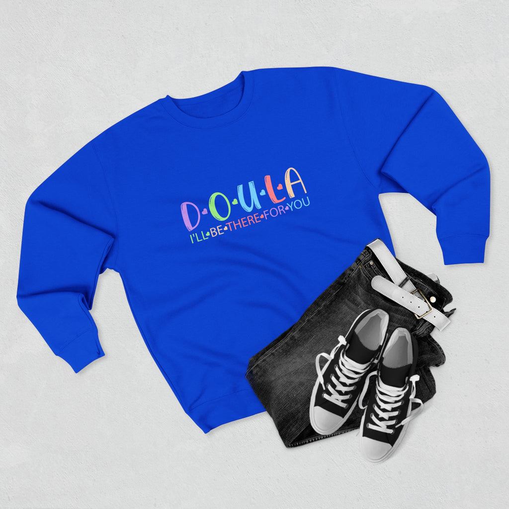 Blue sweatshirt with 'D.O.U.L.A. I'll be there for you' text, black pouch, and sneakers on a light gray background