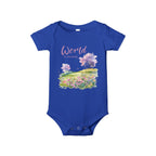 Baby onesie with "World is amazing" text and pastel nature design, made from soft 100% Airlume cotton, displayed flat with envelope neckline and snap closures.