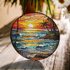Stained glass suncatcher featuring a vibrant beach sunset with ocean waves and warm colors