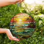 Stained glass suncatcher featuring a vibrant beach sunset with ocean waves and warm colors