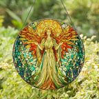 Stained glass angel artwork hanging against a green leafy background